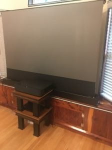 Click to view full screen VIVIDSTORM S PRO P Motorised Rollable ALR/CLR UST Laser Projector Screen with Acoustic Transparency photo review